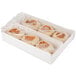 A white box of Thomas' Original English Muffins with plastic wrapping around the muffins inside.