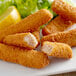 A plate of High Liner Foods precooked whole grain breaded Pollock fish sticks with lemon wedges.