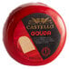 A red wax wheel of Castello Gouda cheese with a black label.