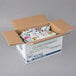 A white box full of Ken's Foods Fat-Free Raspberry Vinaigrette packets.