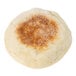 A 4" round white Thomas' English muffin with brown spots.