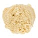 A close up of a David's Cookies white chocolate chip macadamia nut cookie.