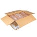 A box with 10 plastic-wrapped loaves of European Bakers whole wheat bread.