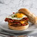 A breakfast sandwich with a Hatfield Chef Signature pork sausage patty, fried egg, and cheese.