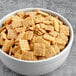 A bowl of Quaker Life cereal on a table.