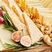 A platter of Ellsworth Cooperative Creamery Ghost Pepper Monterey Jack cheese with grapes and nuts.
