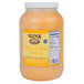 A plastic container of Ken's Foods Golden Italian Dressing on a deli counter.