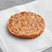 A Gardein black bean veggie burger patty on a white surface.