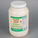 A white plastic container of Ken's Foods whipped salad dressing with a green label.
