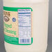 A white Ken's Foods gallon container of whipped salad dressing with a label.