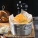 A metal container filled with Chef Pierre Sweet Cornbread on a table.