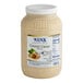 A 1-gallon plastic jar of Ken's Essentials Creamy Caesar Dressing.