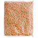 A Kellogg's Apple Jacks bag of cereal with green and orange pieces.