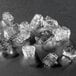 A group of cubelet ice pieces in a black and white photo.