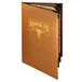 A brown leather Menu Solutions Bella Collection menu cover with a gold logo on a table.