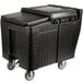 A black plastic Cambro mobile ice bin with wheels.