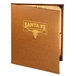 A brown leather Menu Solutions Bella menu cover on a table with a logo on it.