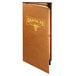 A brown leather-like Menu Solutions booklet cover on a table in a Mexican restaurant.