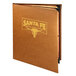 A brown leather Menu Solutions Bella Collection booklet menu cover with a logo on it.