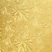 A close up of a gold patterned surface with floral designs on an Enjay gold round cake drum.