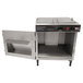 A Benchmark USA tortilla chip warmer on a counter with the door open.