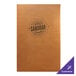 A brown Menu Solutions Bella leather-like menu cover with black text on the front sitting on a table.