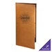 A brown leather Menu Solutions Bella Collection menu cover on a table with a brown leather menu inside.