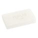 A white rectangular wrapped soap bar with black and white text.