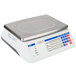 A white Cardinal Detecto digital price computing scale on a counter.