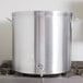 A large silver Vollrath Wear-Ever aluminum stock pot on a stove.