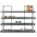 A stainless steel Eastern Tabletop 4 tier riser with glass shelves holding drinks and snacks.