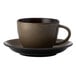 A brown Oneida Rustic porcelain saucer with a coffee cup on it.