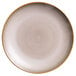 A close-up of a white Oneida Sama porcelain coupe plate with a brown rim.