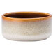 A close up of a Oneida Rustic Sama porcelain ramekin with brown and white speckles.