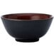 A black Oneida Rustic bowl with red speckled rim.