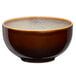 A brown Oneida Rustic Sama porcelain bowl with a white speckled rim.