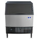 A Manitowoc NEO undercounter ice machine with a stainless steel and black exterior.