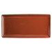 A brown rectangular Terra Verde Cotta porcelain appetizer tray with specks.