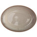 An Oneida Terra Verde Natural porcelain oval bowl with brown speckled design.