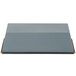 A grey rectangular object with a black border and a red handle, a Matfer Bourgeat Exopan steel bread loaf pan.
