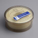A Matfer Bourgeat plastic container with a white label containing round dough cutters.