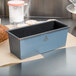 A rectangular Matfer Bourgeat steel bread loaf pan on a counter.