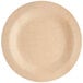 A close up of a Bamboo by EcoChoice round wooden plate.