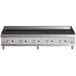 A Cooking Performance Group 60" gas lava briquette charbroiler on a stainless steel counter.