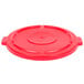 A red plastic lid for a Rubbermaid BRUTE trash can with a handle.