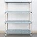 A white MetroMax Q metal shelf with small rectangular squares.