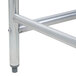 A silver metal table leg with a bolt.