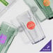 A group of Cambro Laguna Spanish Green plastic tumblers.