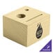 A natural wood block with a hole in the middle and a small hole in the side.