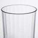 A clear plastic pedestal wine cup with a black rim.